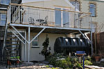 Railed balcony, Tre-Taliesin. Click for an enlargement.